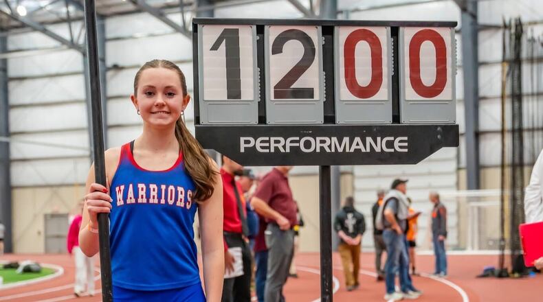 Northwestern High School senior Alaina Freeze poses for a photo after a recent meet. CONTRIBUTED PHOTO