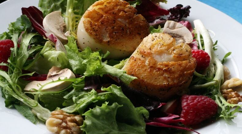 Pan-seared Scallops with Fresh Greens and Raspberries, in a June 2008 file image. (Mary Schroeder/Detroit Free Press/TNS)