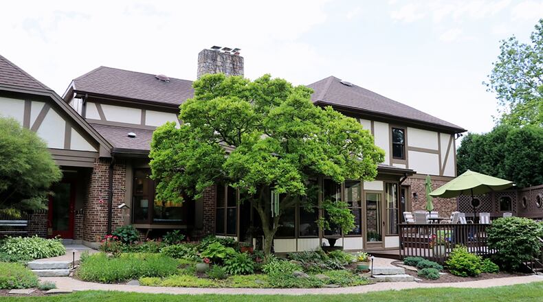 A semi-private rear deck has access to the full bathroom off the first-floor main bedroom. The same deck is accessible from the enclosed porch.