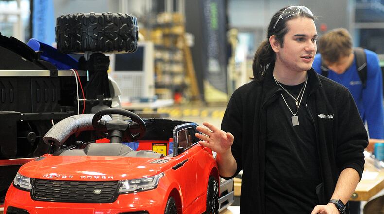 Kaden Gillespie talks about redesigning toy cars for kids with disabilities at the Greene County Career Center. Gillespie was part of a class redesigning toy cars for kids with disabilities. MARSHALL GORBY\STAFF