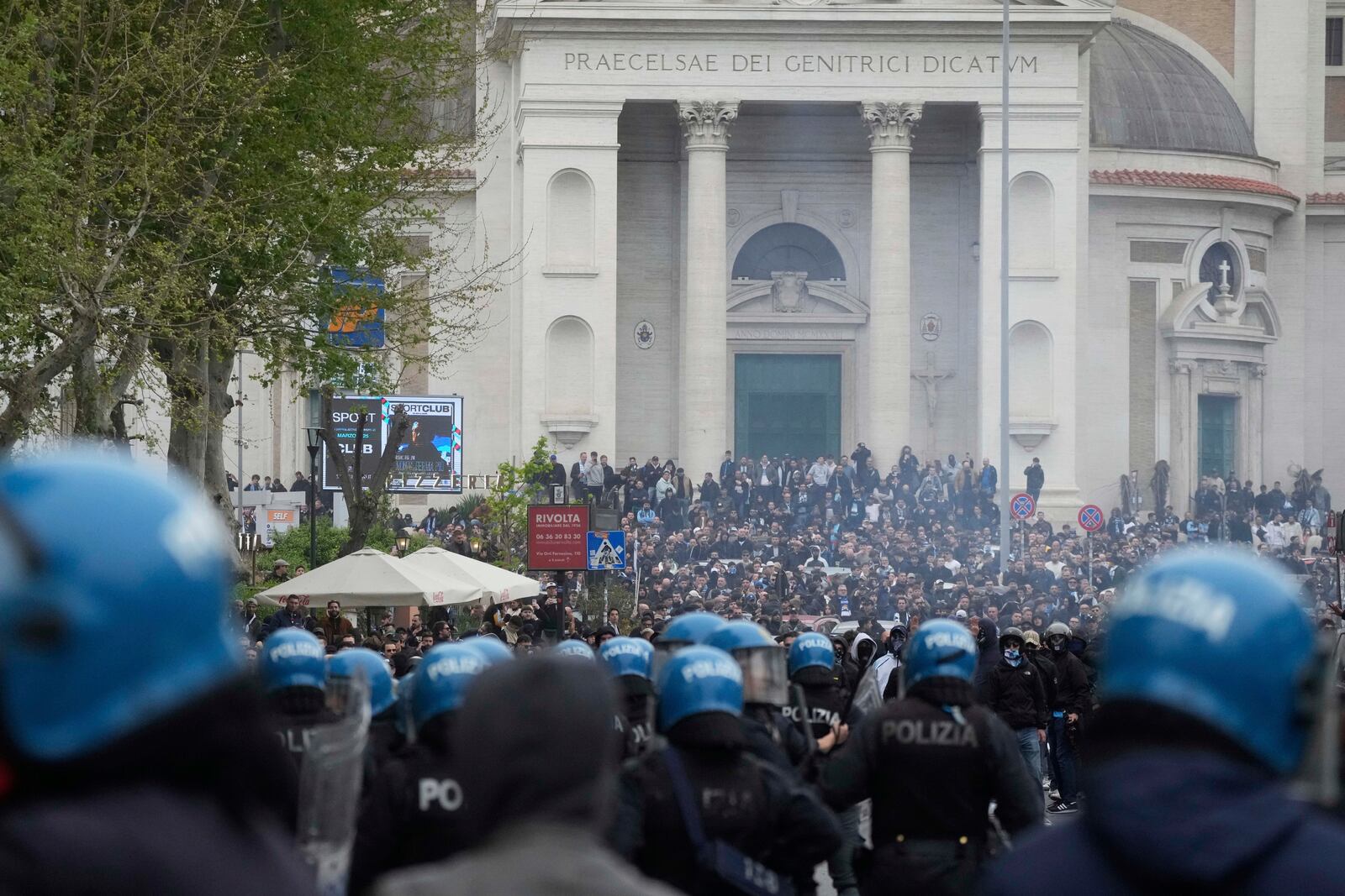 Lazio fans riot with police ahead of the Italian Serie A soccer match between Lazio and Roma at Rome's Olympic stadium, Sunday, April 13, 2025. (AP Photo/Gregorio Borgia)