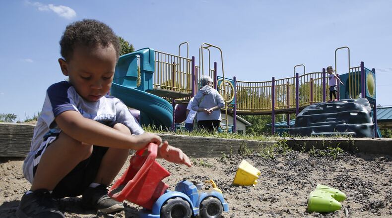 Aeshan Evans plays in the sandbox at Shullgate Park in Huber Heights on one of the nicest days in May when the sun was shining and temperatures reached into the 70’s. TY GREENLEES / STAFF