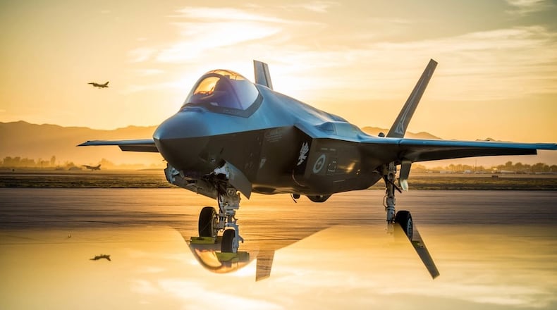 The sun sets behind an Australian F-35A Lighting II at Luke Air Force Base, Ariz., June 27, 2018. The first Australian F-35 arrived at Luke in December 2014.
While allies and military pilots appear to love the F-35, it has been the focus of persistent criticism for its cost and difficulty in mainintaining. (U.S. Air Force photo by Staff Sgt. Jensen Stidham) Note: This image was created by placing a reflective surface in front of the the camera lens.