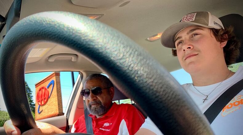 AAA driving school instructor Guy Jones, left, with student driver Zach Lehman, 16, as they head out for an on-road session Tuesday May 31, 2022. MARSHALL GORBY\STAFF