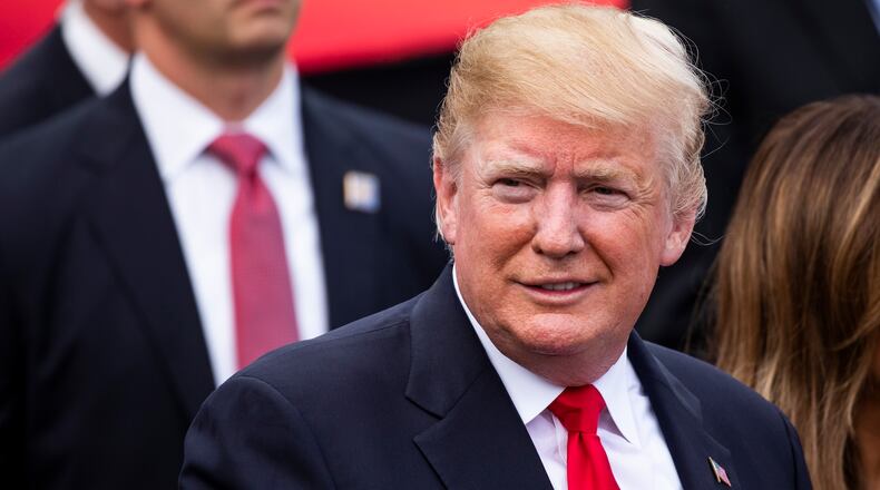 President Donald Trump and first lady Melania Trump attend a picnic for military families on the South Lawn of the White House in Washington, July 4, 2018. Earlier on the holiday, Trump traveled to his golf resort in northern Virginia. (Samuel Corum/The New York Times)