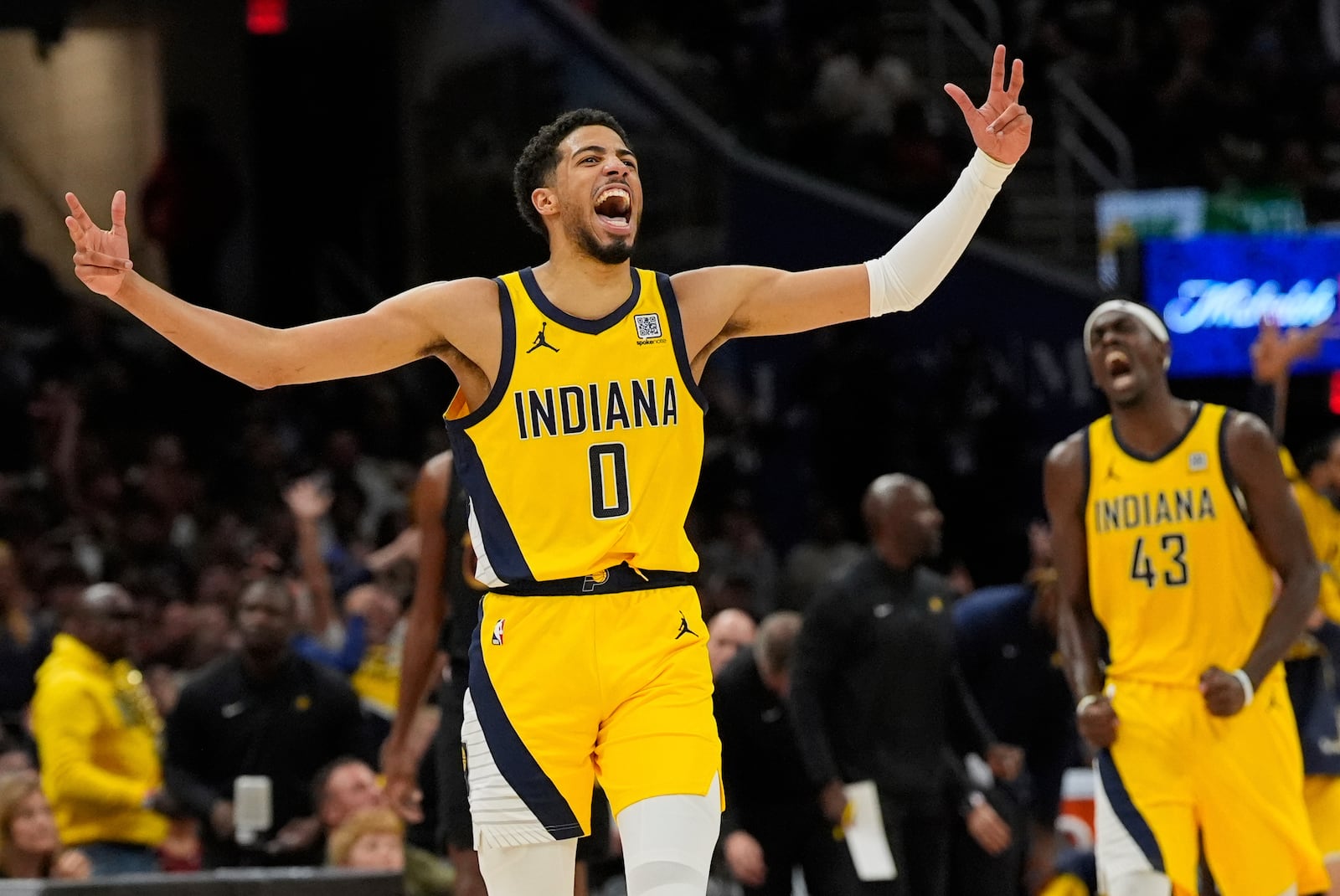 Indiana Pacers guard Tyrese Haliburton, left, celebrates along with forward Pascal Siakam after scoring during the second half in Game 5 of an Eastern Conference semifinal NBA basketball playoff against the Cleveland Cavaliers, Tuesday, May 13, 2025, in Cleveland. (AP Photo/Sue Ogrocki)