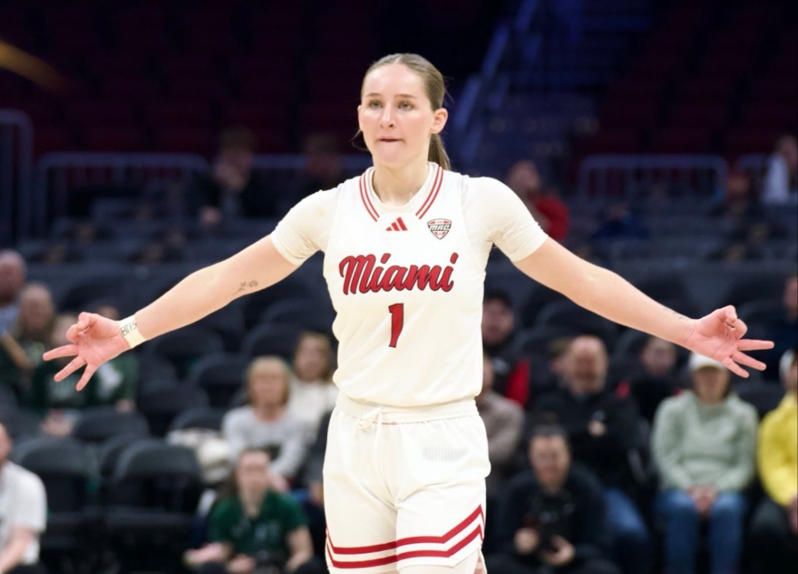 Miami’s Amber Scalia celebrates after making a 3-pointer during her Mid-American Conference Tournament game against Ohio on Friday at Rocket Arena. MIAMI ATHLETICS PHOTO