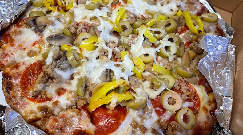 201 Tavern, a new restaurant serving pizza, subs and more, has opened in the former spot of Paisano’s Pizza Pub in the Old North Dayton neighborhood. NATALIE JONES/STAFF