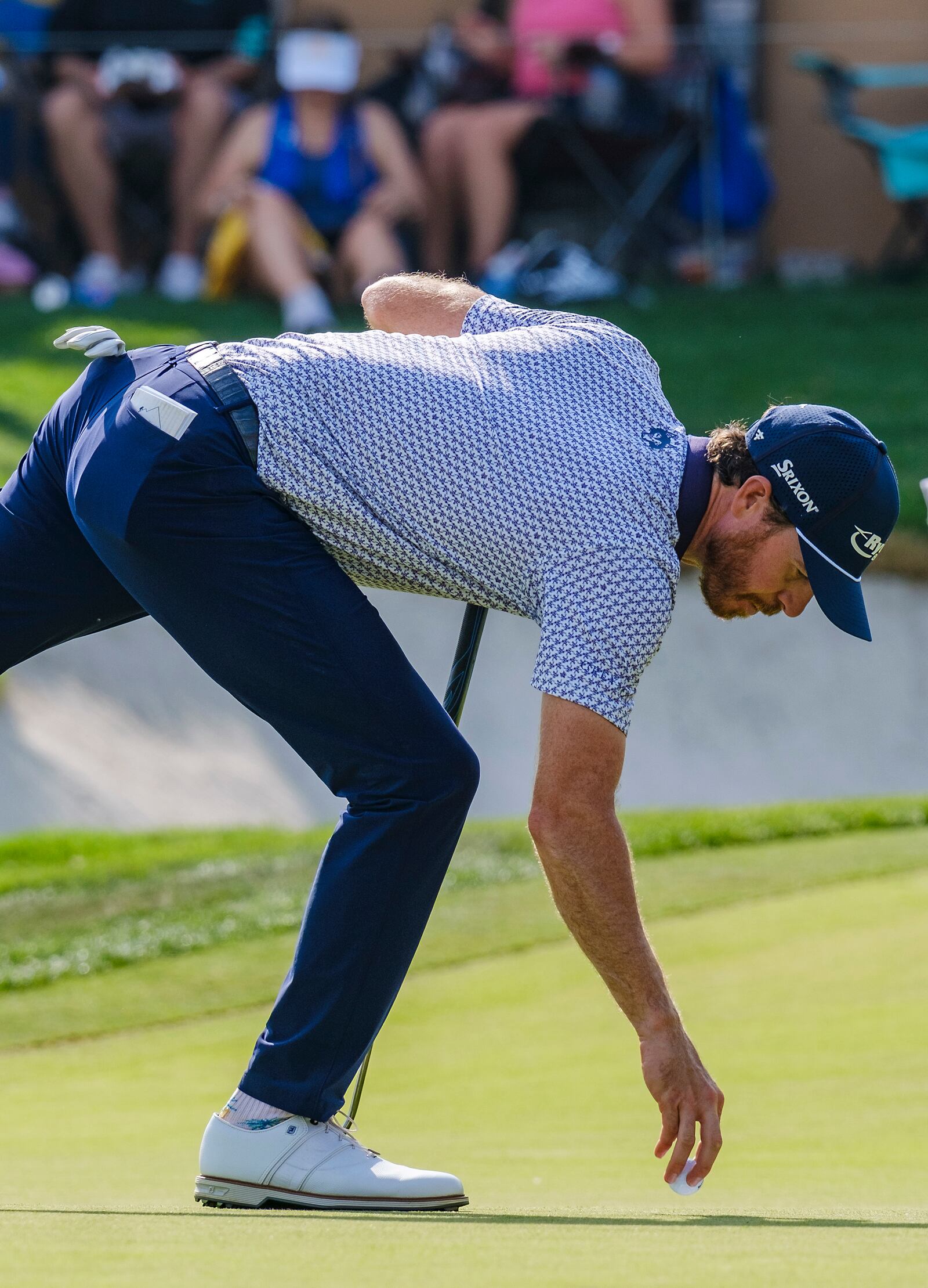 Sam Ryder gets his ball out of the cup after making a birdie on the 16th hole during the first round of the Texas Open golf tournament, Thursday, April 3, 2025, in San Antonio, Texas. (AP Photos/Rodolfo Gonzalez)