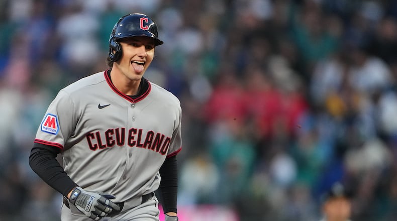 Cleveland Guardians' Chase DeLauter jogs the bases after hitting a solo home run against Seattle Mariners starting pitcher Logan Gilbert during the first inning of an opening-day baseball game, Thursday, March 26, 2026, in Seattle. (AP Photo/Lindsey Wasson)