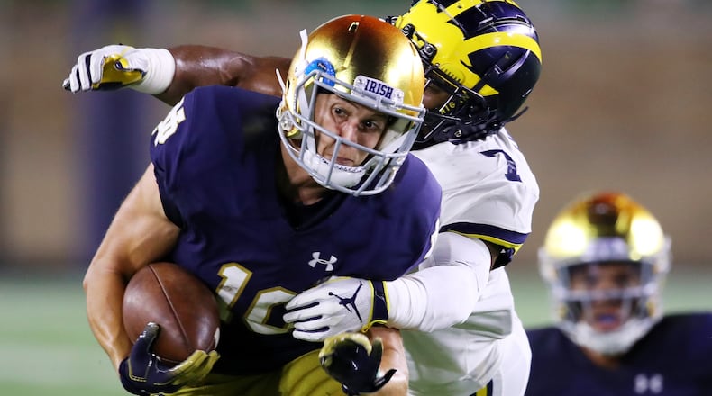 SOUTH BEND, IN - SEPTEMBER 01: Khaleke Hudson #7 of the Michigan Wolverines tackles Chris Finke #10 of the Notre Dame Fighting Irish in the second quarter at Notre Dame Stadium on September 1, 2018 in South Bend, Indiana. (Photo by Gregory Shamus/Getty Images)