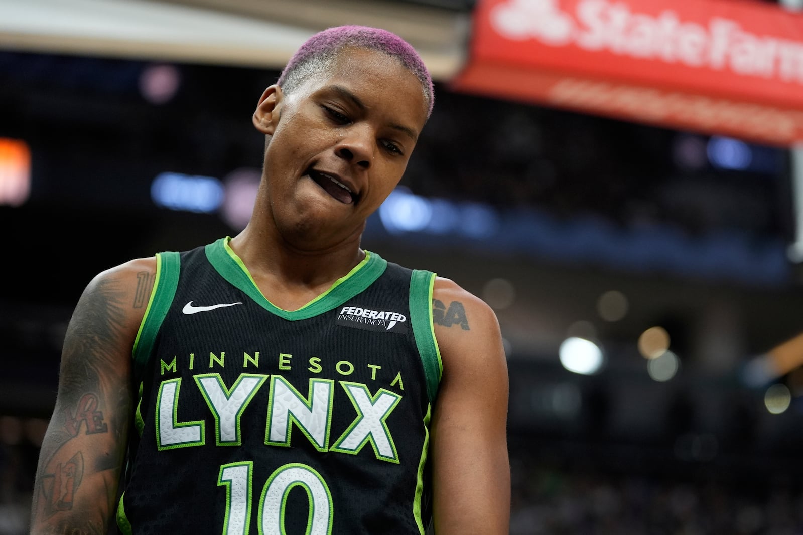 Minnesota Lynx guard Courtney Williams (10) reacts after turning the ball over during the first half of the WNBA Commissioner's Cup championship basketball game against the Indiana Fever, Tuesday, July 1, 2025, in Minneapolis. (AP Photo/Abbie Parr)