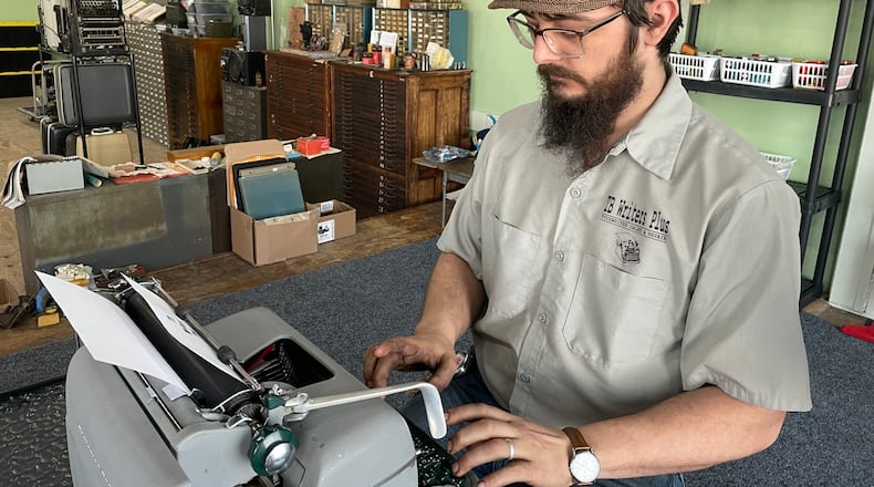 TB Writers Plus is a typewriter sales and repair shop located in the Davis-Linden Building at 400 Linden Ave. in Dayton. Pictured is owner Trevor Brumfield. NATALIE JONES/STAFF