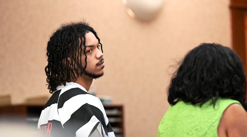 Dominick Grubb, 18, of Hamilton, was indicted in March on attempting to hire a person to kill a woman allegedly involved in another case he's involved with, an aggravated robbery from November 2024. Pictured is Grubb on April 3, 2025, with his attorney, Arica Underwood, who he told Butler County Common Pleas Judge Jennifer McElfresh, he no longer wants her services and plans to retain a new attorney. MICHAEL D. PITMAN/FILE