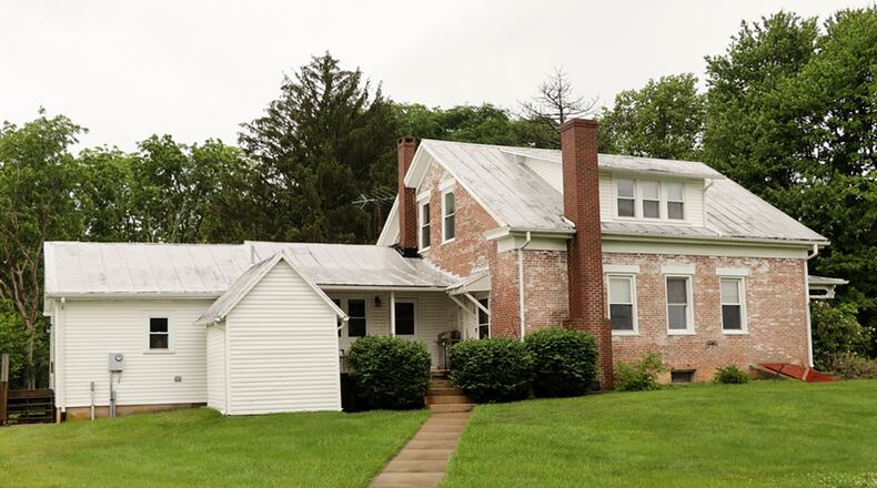 The 10-acre property situated between Yellow Springs and Cedarville includes the a historical white-wash, brick farmhouse with about 2,000 sq. ft. of living space. The property also has a second residence for possible multi-generation independent living or rent income, a bank barn, a pole barn with overhead door, a heated workshop and garden shed. CONTRIBUTED PHOTO BY KATHY TYLER
