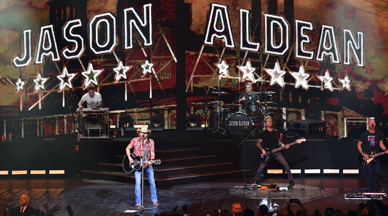 LAS VEGAS, NEVADA - DECEMBER 06: (L-R) Pedal steel guitarist Jay Jackson, recording artist Jason Aldean, drummer Rich Redmond, bassist Tully Kennedy and guitarist Jack Sizemore perform during the launch of Aldean's three-night "JASON ALDEAN: RIDE ALL NIGHT VEGAS" engagement at Park Theater at Park MGM on December 6, 2019 in Las Vegas, Nevada. (Photo by David Becker/Getty Images)