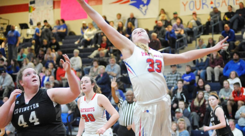 Maddie Downing of Tri-Village snaps a rebound away from Covington s Lauren Christian. Tri-Village defeated visiting Covington 44-35 in a girls high school basketball game on Thursday, Jan. 10, 2019. MARC PENDLETON / STAFF