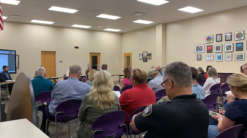 Crowds gathered at the Bellbrook-Sugarcreek school board meeting Thursday as the board voted to create a volunteer Active Shooter Response Team. LONDON BISHOP/STAFF