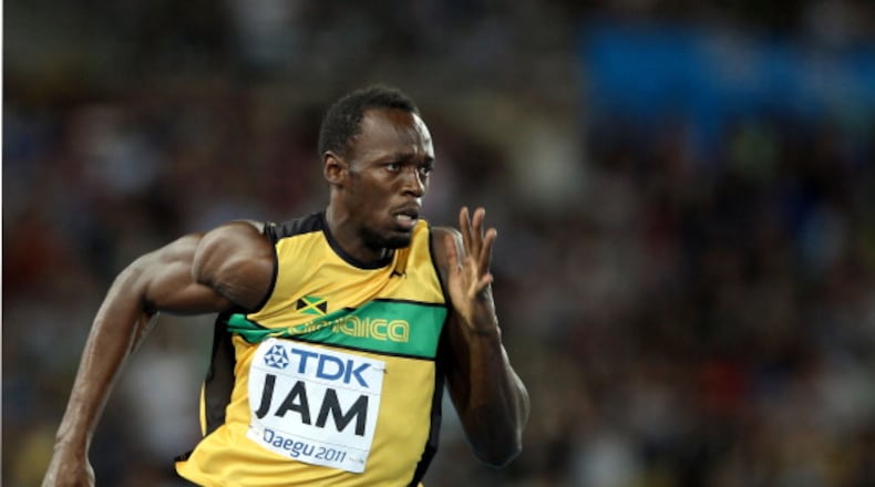 DAEGU, SOUTH KOREA - SEPTEMBER 04: Usain Bolt of Jamaica sprints to victory and a new world record in the men's 4x100 metres relay final during day nine of 13th IAAF World Athletics Championships at Daegu Stadium on September 4, 2011 in Daegu, South Korea. (Photo by Ian Walton/Getty Images)