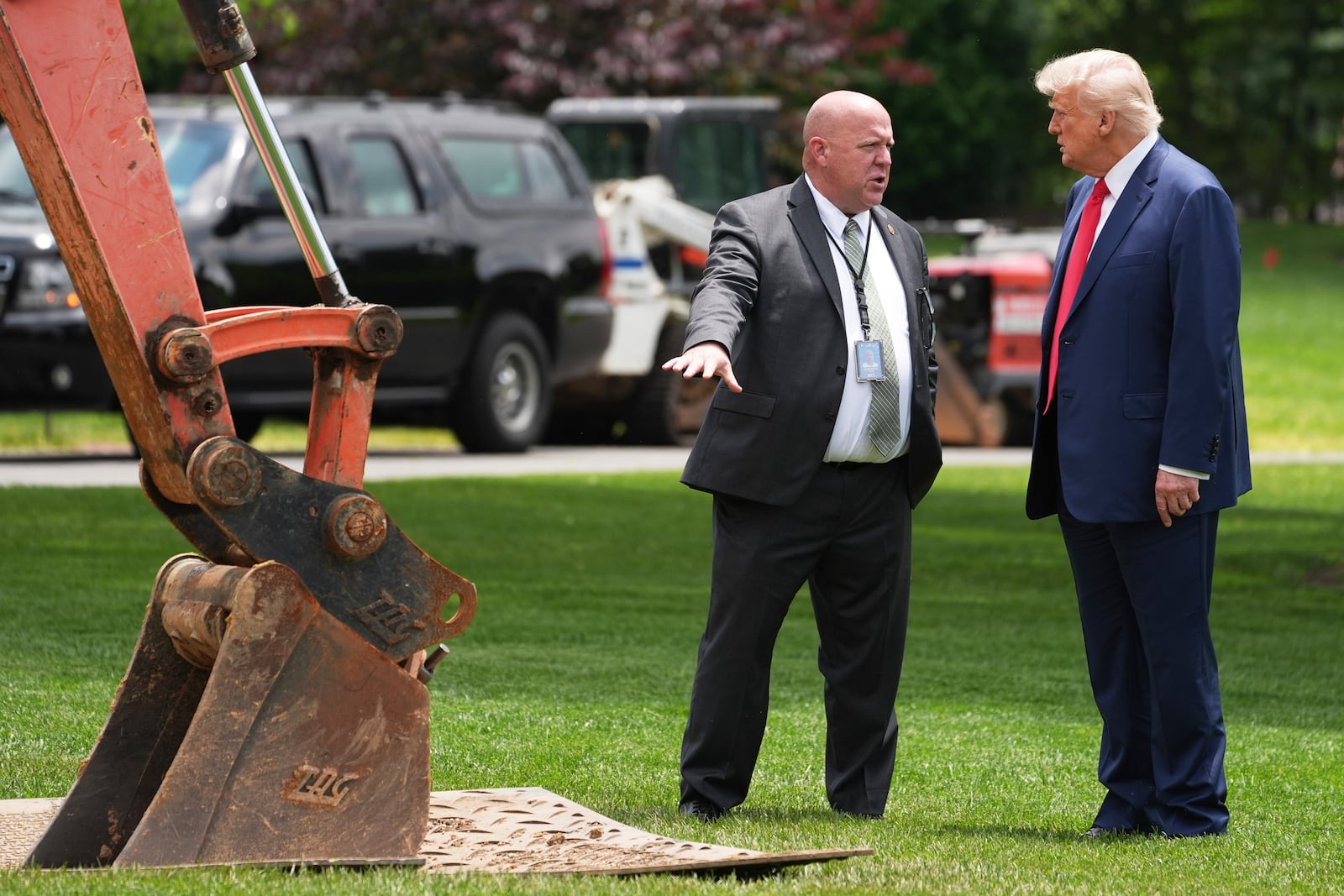 President Donald Trump looks over a construction project on the South Lawn of the White House, after his arrival, Monday, June 9, 2025, in Washington. (AP Photo/Evan Vucci)