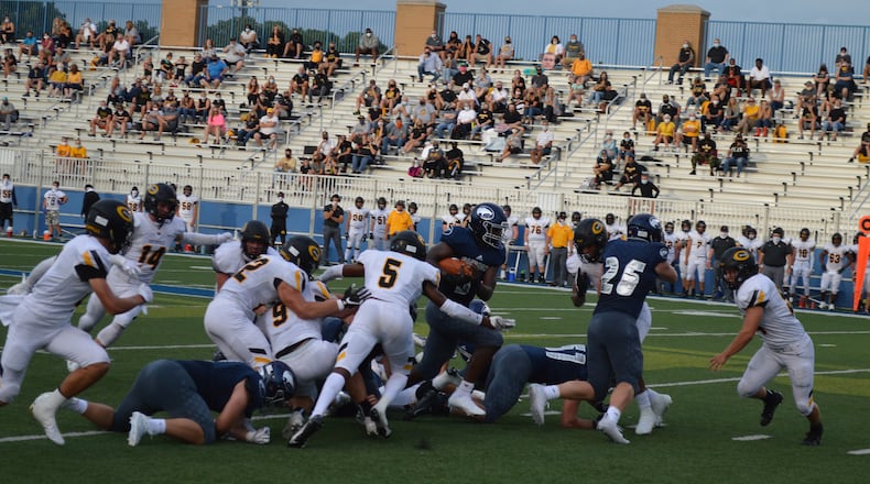Fairmont's Tank Gant runs the ball against Centerville in the season opener at Roush Stadium on Friday, Aug. 28, 2020. Eric Frantz/CONTRIBUTED