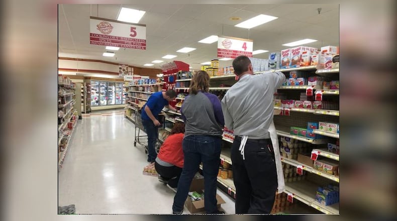 On a Saturday in November 2019,  Arcanum residents took to stocking shelves at Sutton's Foods  to help out local grocery store./Contributed