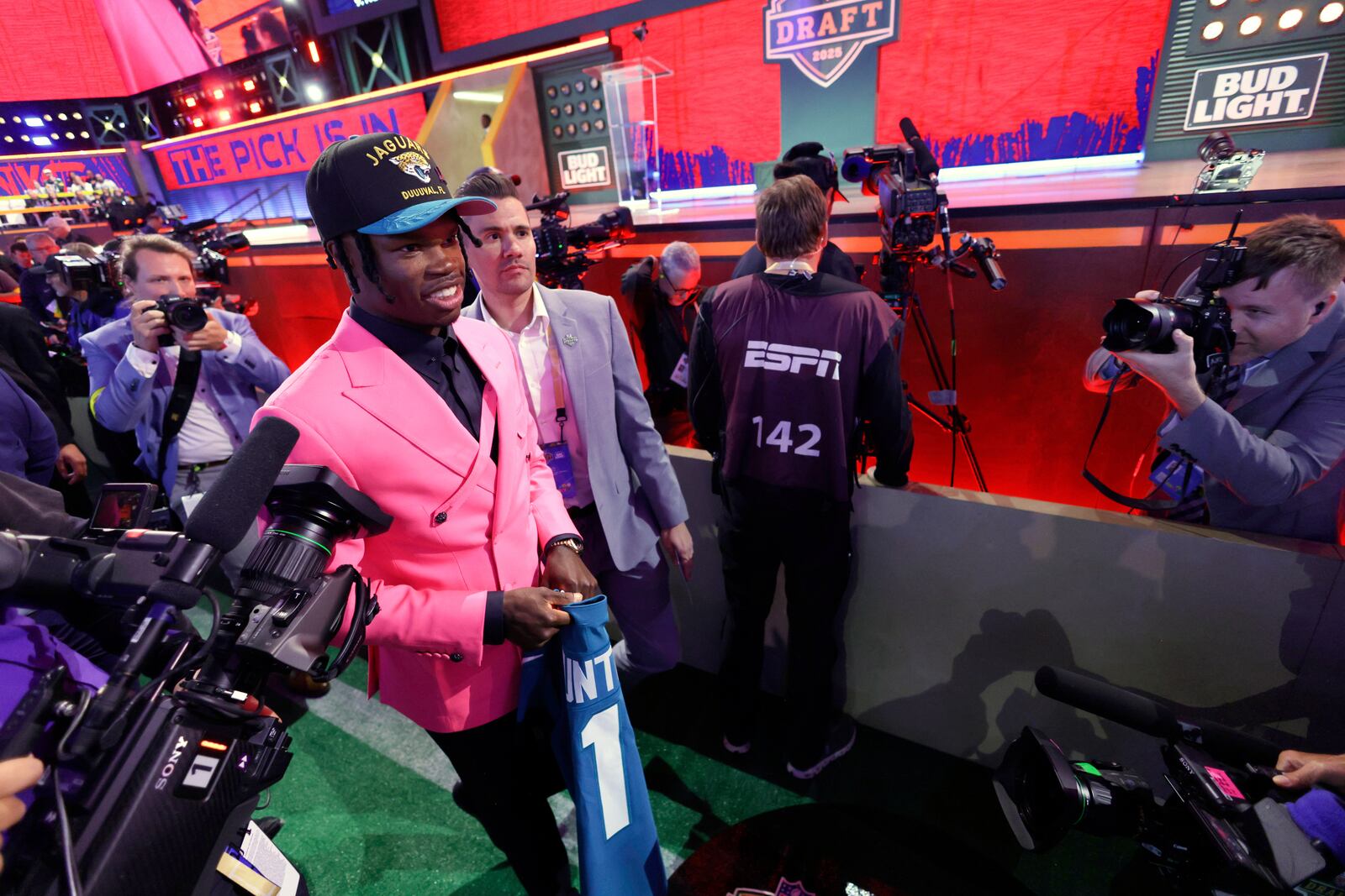 Colorado wide receiver Travis Hunter walks through the crowd after being chosen by the Jacksonville Jaguars with the second overall pick during the first round of the NFL football draft, Thursday, April 24, 2025, in Green Bay, Wis. (AP Photo/Matt Ludtke)