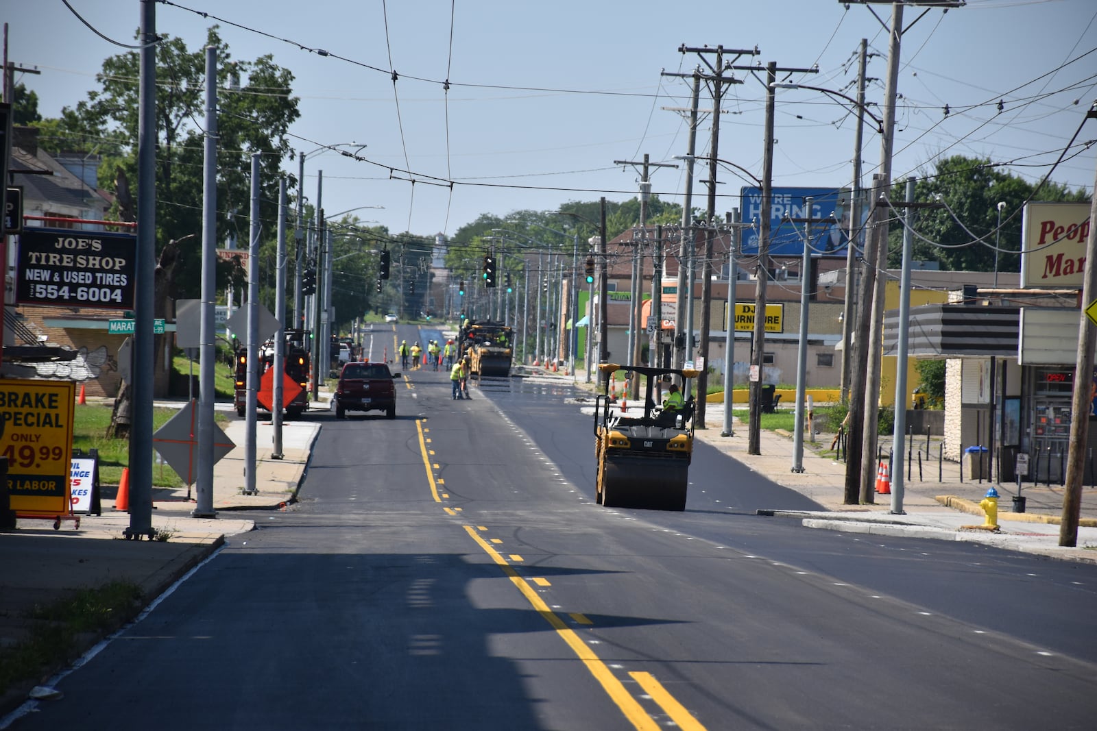 Crews pave North Main Street in Dayton near Hudson Avenue on Tuesday, July 22, 2025. CORNELIUS FROLIK / STAFF