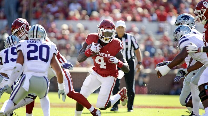 Oklahoma running back Trey Sermon looks for a hole against the Kansas State Wildcats at Gaylord Family Oklahoma Memorial Stadium on October 27, 2018 in Norman, Oklahoma. Oklahoma defeated Kansas State 51-14. (Photo by Brett Deering/Getty Images)