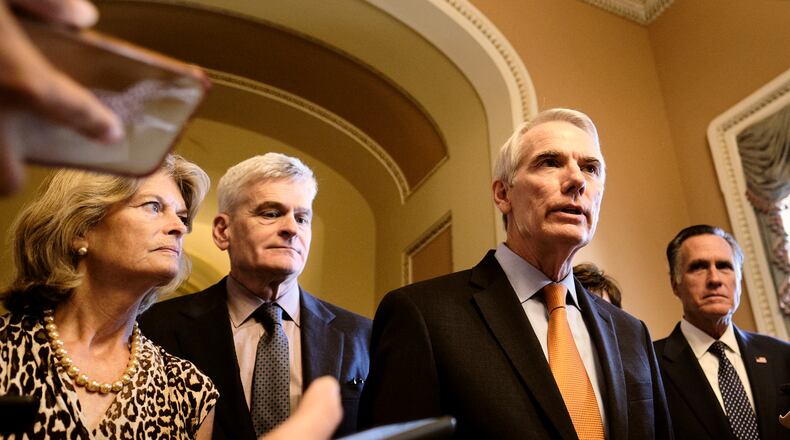 From left: Sens. Lisa Murkowski (R-Alaska), Bill Cassidy (R-La.), Rob Portman (R-Ohio), and Sen. Mitt Romney (R-Utah) speaks to reporters about the infrastructure deal on Wednesday, July 28, 2021, at the Capitol in Washington, The return of a mask mandate on Capitol Hill has prompted a political fight in Congress, where Democrats from low-risk areas are complying while Republicans protest fiercely. (T.J. Kirkpatrick/The New York Times)