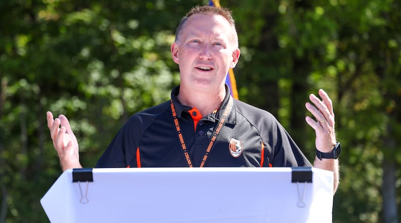 Beavercreek City Schools superintendent Paul Otten speaks during a ceremony on Wednesday, Oct. 1 in the parking lot of Beavercreek High School. The ceremony was in recognition of Ferguson Land Lab being added to Old Growth Forest Network. The forest is located east of the school. BRYANT BILLING / STAFF