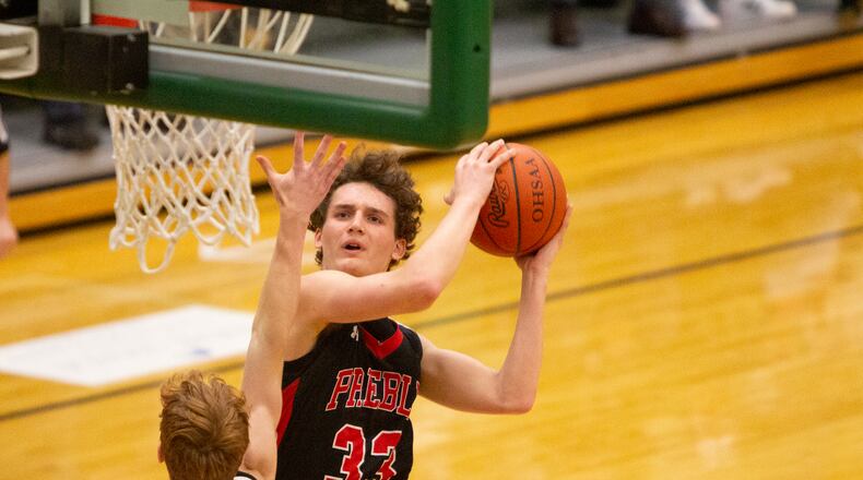 Preble Shawnee senior Bryce Singleton drives to the basket in the third quarter of Thursday night's Division III sectional victory over Covington at Northmont High School. Jeff Gilbert/CONTRIBUTED