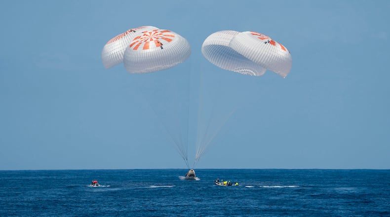 Larry Connor of Dayton and two other businessmen returned from the International Space Station with their astronaut escort Monday, wrapping up a pricey trip that marked NASA's debut as a B&B host.