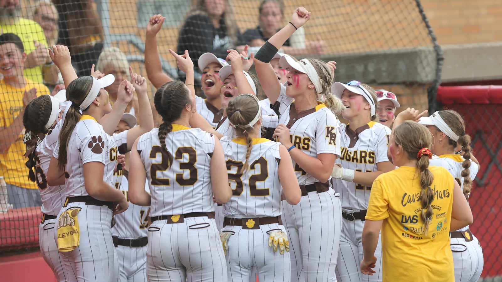 The Kenton Ridge High School softball celebrates after beating Hillsboro 9-0 in the Division IV state championship game on Thursday, June 5 at Akron's Firestone Stadium. MICHAEL COOPER / STAFF MICHAEL COOPER / STAFF