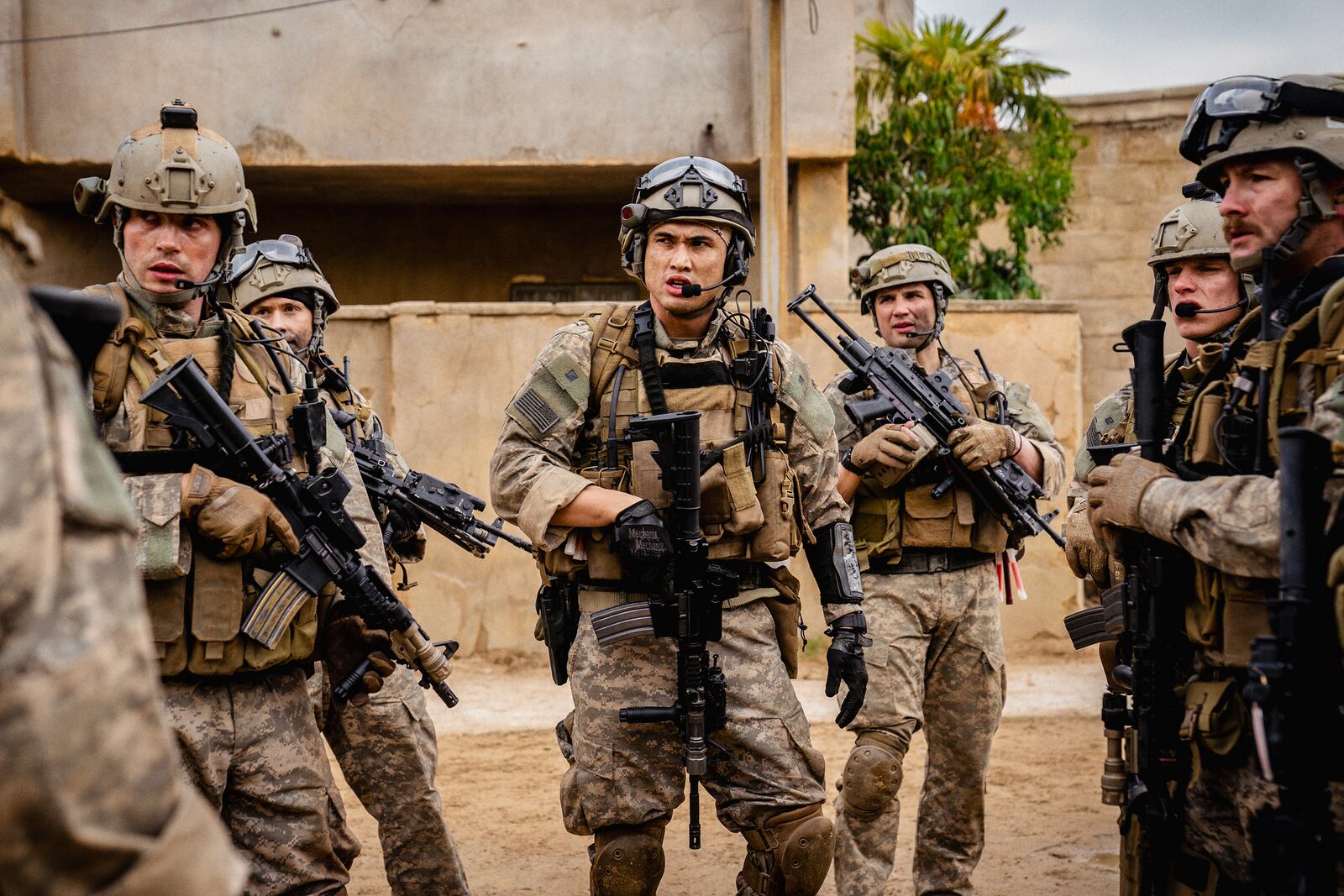 This image released by A24 shows Charles Melton, center, in a scene from "Warfare." (A24 via AP)