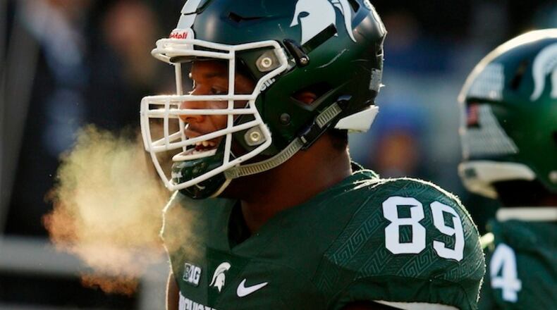 Michigan State's Shilque Calhoun warms up before an NCAA college football game against Penn State, Saturday, Nov. 28, 2015, in East Lansing, Mich. (AP Photo/Al Goldis)