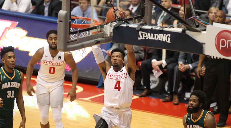 Charles Cooke dunks in the first half. David Jablonski/Staff