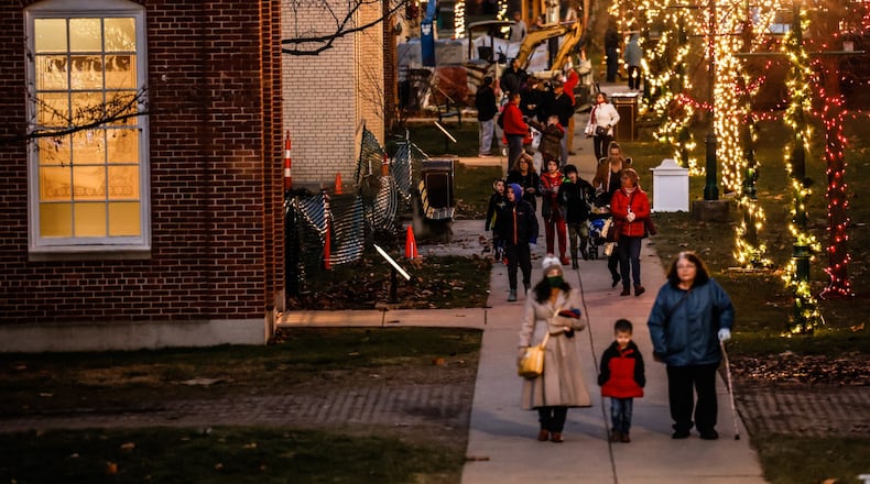 The Carillon Historical Park transforms into a holiday wonderland each November and December. Thousands of light adorn the historic buildings. There are model train displays, gift shops and a bakery. JIM NOELKER/STAFF
