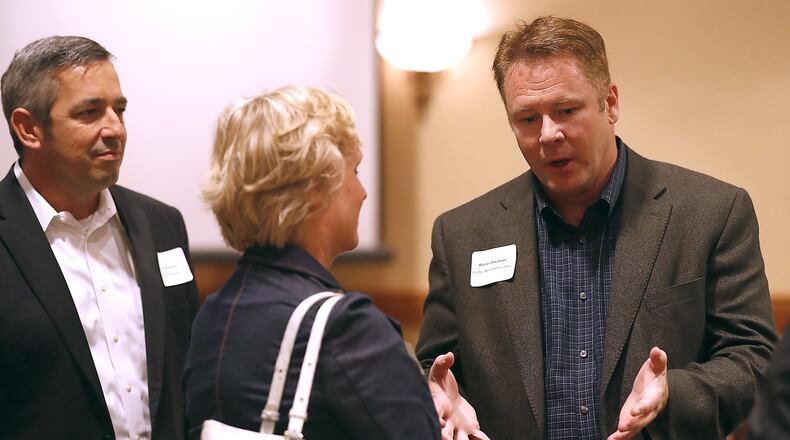 Congressman Warren Davidson talks with people after he spoke at the Chamber of Greater Springfield’s Legislative Luncheon Thursday at The Courtyard by Marriott in Springfield. Bill Lackey/Staff