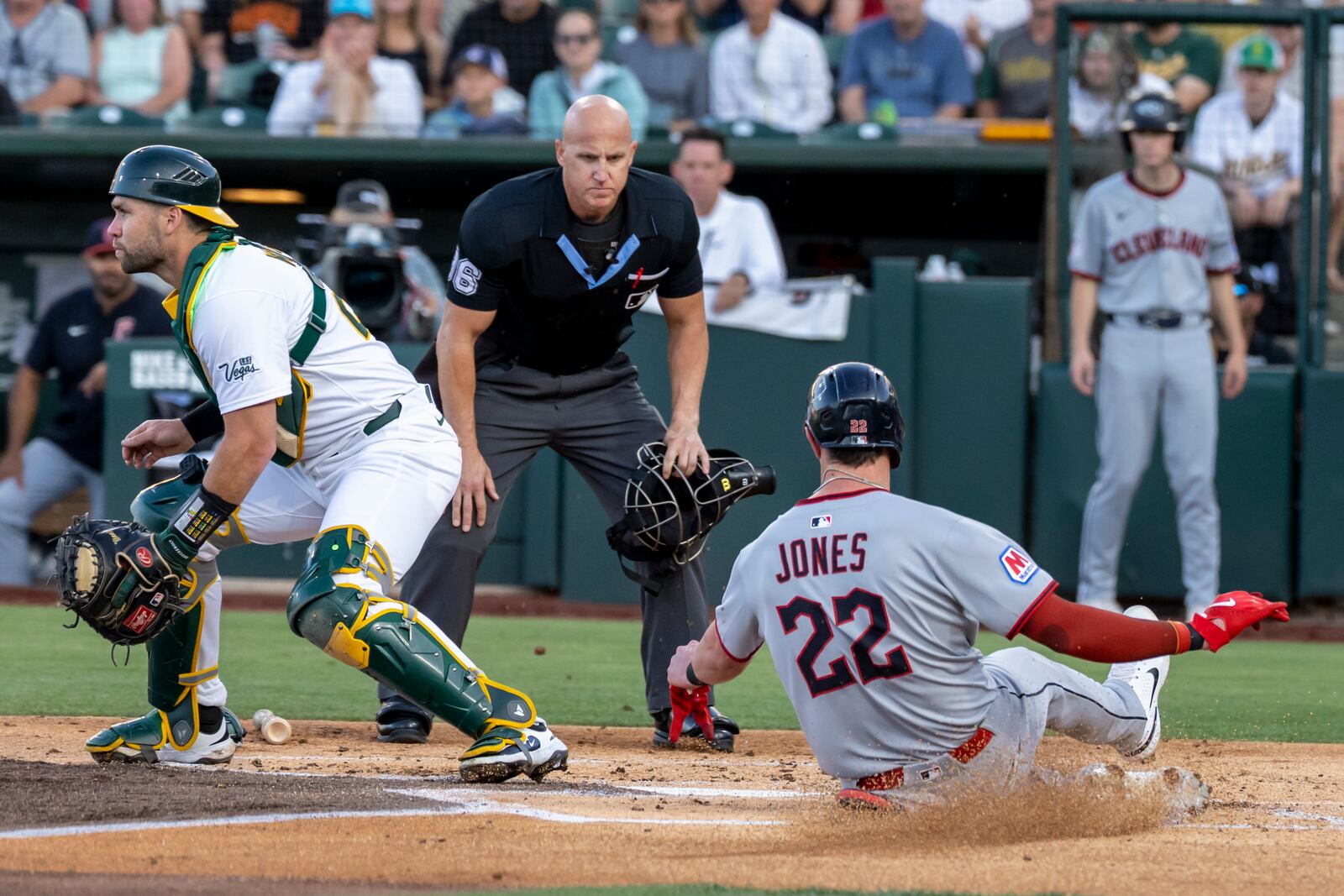 Cleveland Guardians' Nolan Jones (22) scores during the second inning of a baseball game against the Athletics Saturday, June 21, 2025, in West Sacramento, Calif. (AP Photo/Sara Nevis)