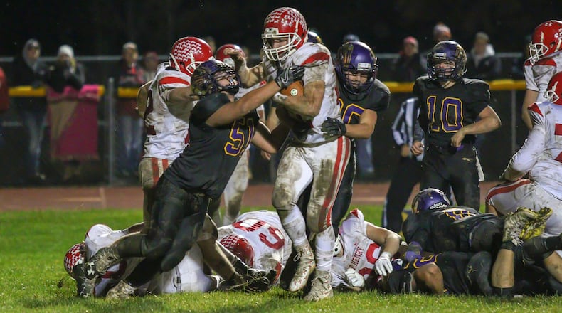 St. Henry senior Zach Niekamp runs for one of his four touchdowns on the night as the Redskins beat Mechanicsburg 37-7 in a Division VI, Region 24 quarterfinal game at Indian Stadium on Friday night. CONTRIBUTED PHOTO BY MICHAEL COOPER