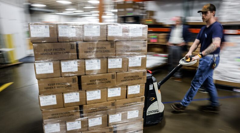 A forklift full of killer brownies is moved into a semitruck at the plant in Miamisburg. JIM NOELKER/STAFF