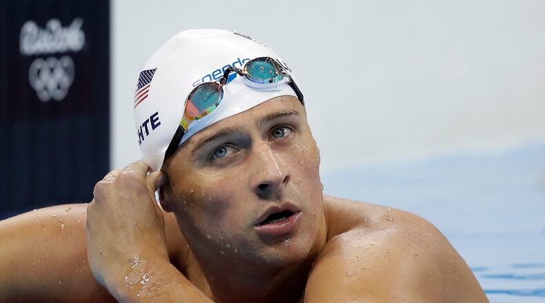 FILE - In this Tuesday, Aug. 9, 2016, file photo, United States' Ryan Lochte checks his time in a men's 4x200-meter freestyle heat during the swimming competitions at the 2016 Summer Olympics, in Rio de Janeiro, Brazil. During an Aug. 30, 2016, appearance on ABC's "Good Morning America," Lochte wouldn't say whether he'd return to Brazil to face charges of filing a false police report over an incident at a gas station during the Games. (AP Photo/Michael Sohn, File)