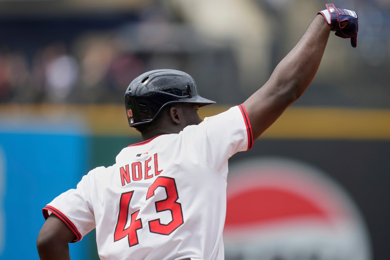 Cleveland Guardians' Jhonkensy Noel (43) gestures as he runs the bases after hitting a home run in the fourth inning of a baseball game against the Minnesota Twins in Cleveland, Thursday, May 1, 2025. (AP Photo/Sue Ogrocki)