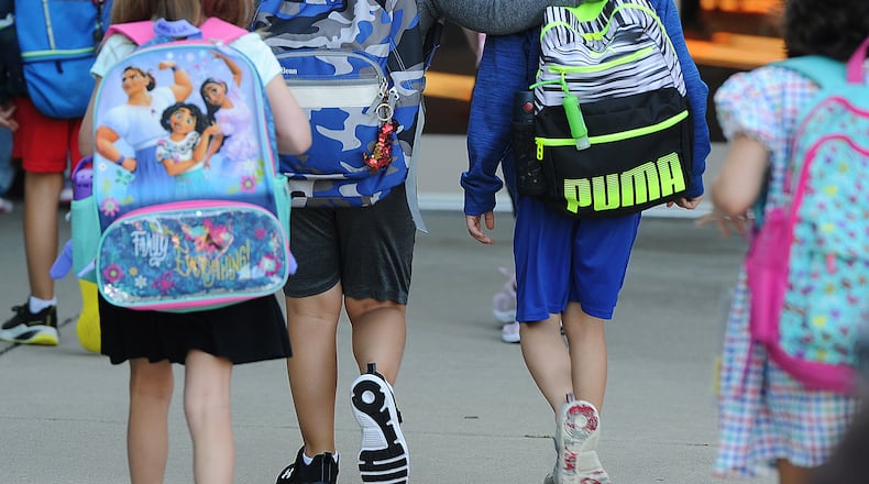 Students enter Centerville Primary Village South, on the first day of school Wednesday August 17, 2022. MARSHALL GORBY\STAFF
