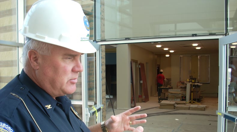 Springboro Police Chief Jeff Kruithoff stands at the entrance to the portion of the new Springboro City Hall for courts and city council. The new building opened in 2009.