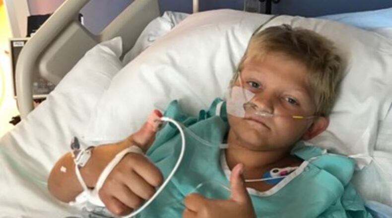 Jackson “Jack” Loyd, 9, is still recovering at Cincinnati Children’s Hospital Medical Center after he fell July 21 from the roof of a trailer onto a trampoline. CONTRIBUTED