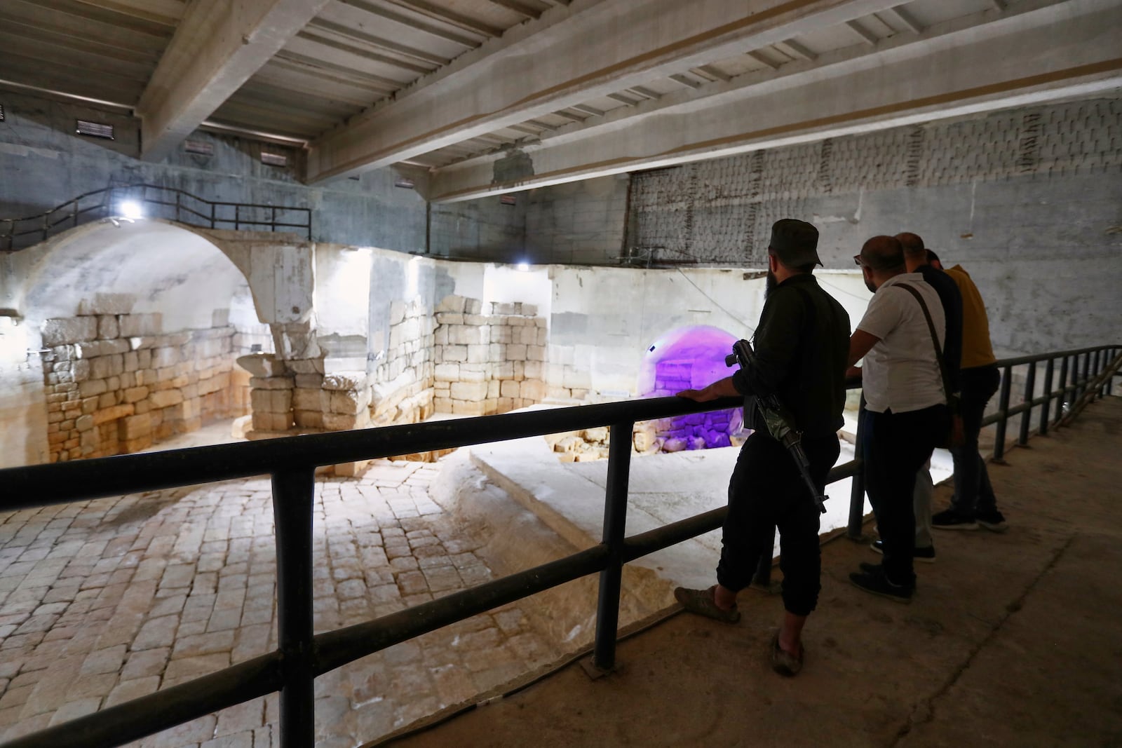 Visitors watch the dry main reservoir of the spring in Ein el-Fijeh, Barada Valley, Syria, Thursday, May 8, 2025. The Ein el-Fijeh spring, the main source of water for Damascus, is almost dry and many people in the capital and its suburbs are now relying on buying water from tanker trucks that fill from wells. (AP Photo/Omar Sanadiki)
