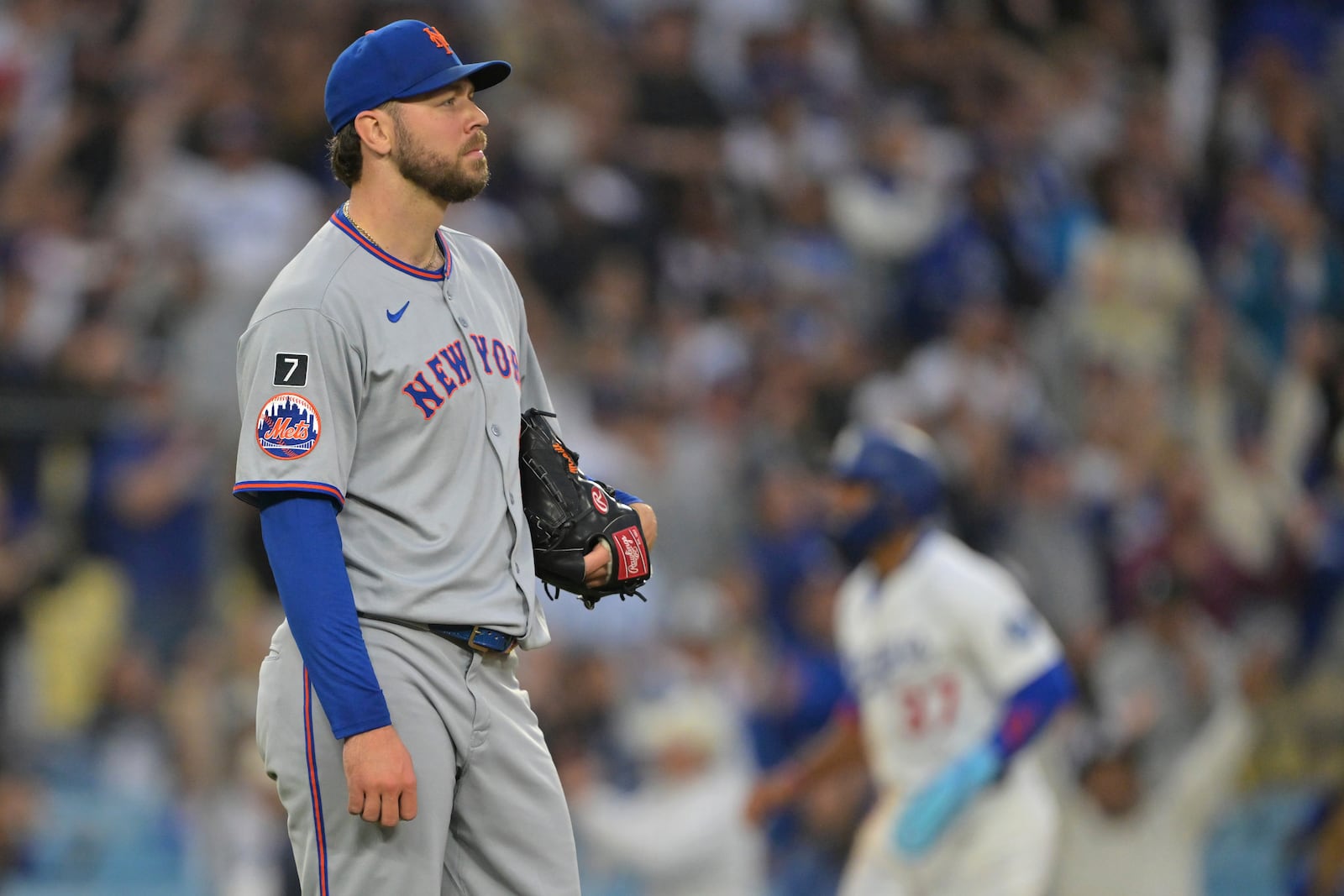 Los Angeles Dodgers' Max Muncy watches the flight of the ball on a two-run home run during the first inning of a baseball game against the New York Mets, Tuesday, June 3, 2025, in Los Angeles. (AP Photo/Jayne Kamin-Oncea)