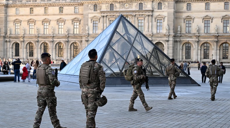 Soldiers patrol in the courtyard of the Louvre museum, Thursday, Oct. 30, 2025 in Paris. (AP Photo/Emma Da Silva)